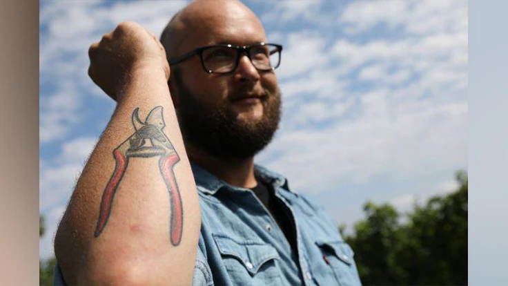 FELCO has many dedicated customers. Here, Nathan Kendall shows off his tattoo of a Felco No. 6 pruning shear. He is photographed at Tuller Vineyards on Seneca Lake.