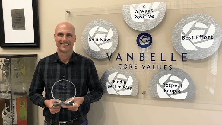 Dave Van Belle holds the 2019 Abbotsford Business Excellence in Corporate Social Responsibility Award.