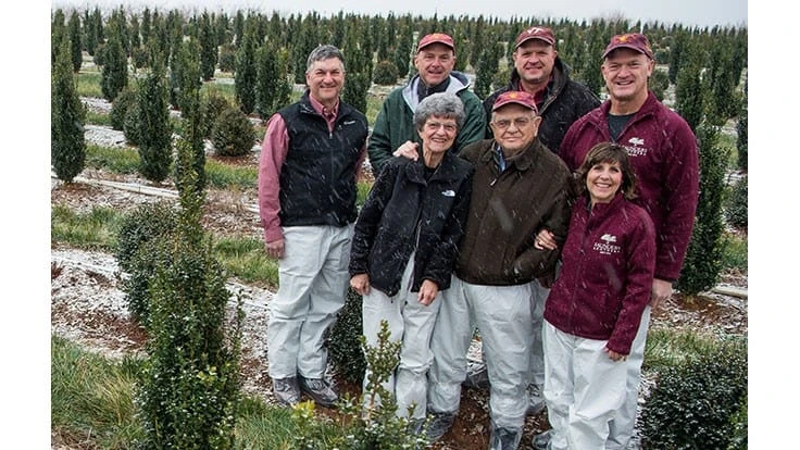 Paul Saunders, surrounded by family in 2017. Back row, L-R: Jim Saunders, Bennett Saunders, Robert Saunders, Tom Saunders. Front row, L-R: Tatum Saunders, Paul Saunders, Lyn Saunders.