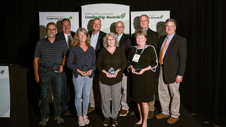 (L-R) Bobby Barnitz, Brian Decker, Erin Caird, Robert Saunders, Gina Falcetti, Bennett Saunders, Bridget Behe, Tom Saunders, Jim Saunders. Jonathan Berry (not pictured) accepted the award on behalf of his father, Jim Berry.