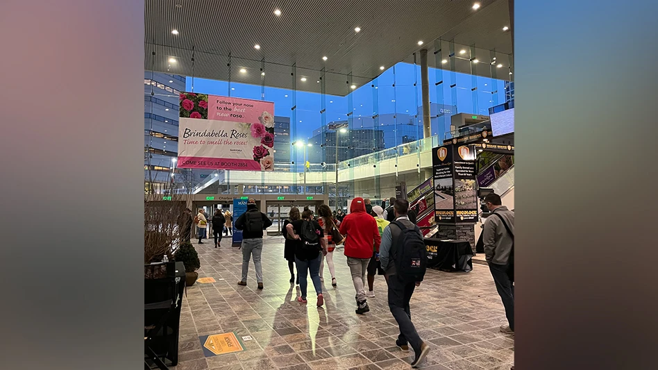Attendees leave the Baltimore Convention Center's Charles St. lobby after a busy day at MANTS 2023.