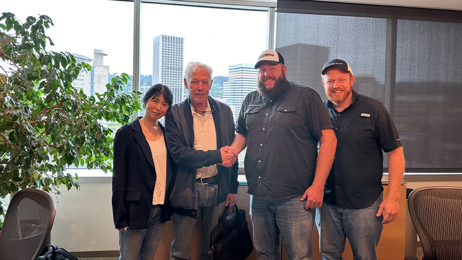 Matthew and Timothy Nichols joined Talon Buchholz in the signing of the purchase agreement.