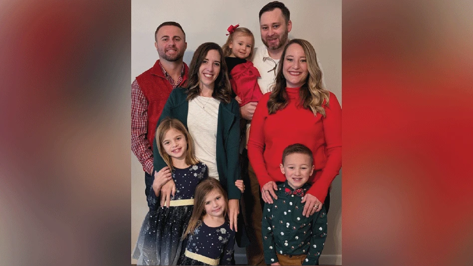 [L-R] Chris Link and Richard Anderson with their families