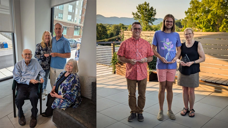 Seven people pose with awards.