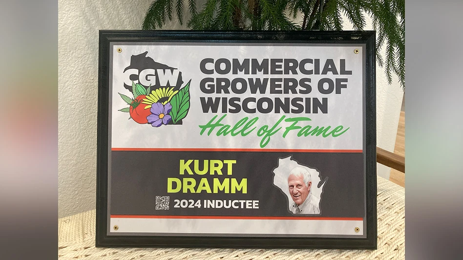 A framed plaque reads CGW Commercial Growers of Wisconsin Hall of Fame: Kurt Dramm, 2024 Inductee.