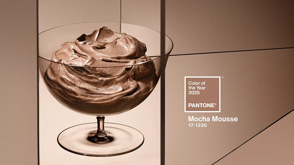 A photo of brown mousse in a clear glass dish. The photo has a background with various shades of brown. To the right of the dish is a brown square with a white outline and white text that reads Color of the Year 2025 Pantone Mocha Mousse 17-1230.