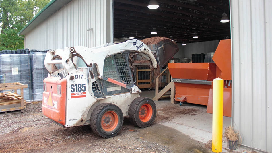 Heavy equipment entering a building