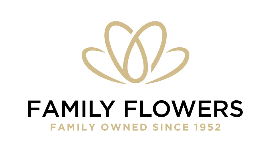 A logo with black and tan text on a white background with the outline of a tan flower graphic. The text reads Family Flowers Family Owned Since 1952.