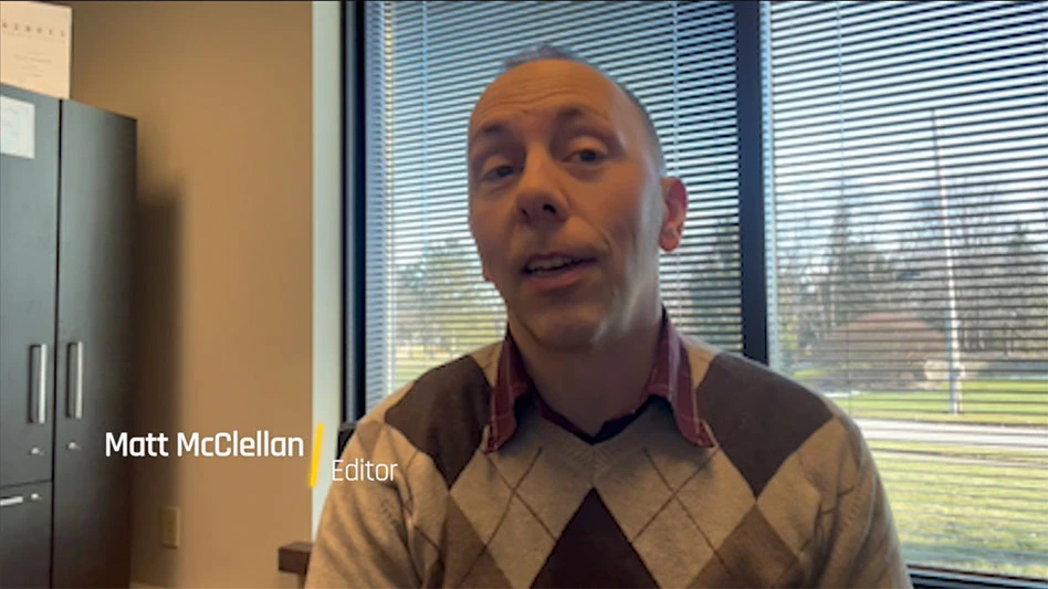 man in office talking about latest magazine