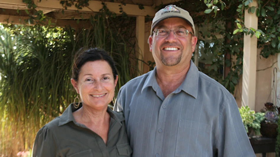 A smiling man and woman.