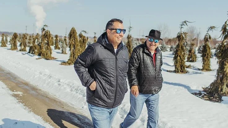 Joe Allio and Angelo Petitti walk the rows at Losely Nursery in Perry, Ohio.