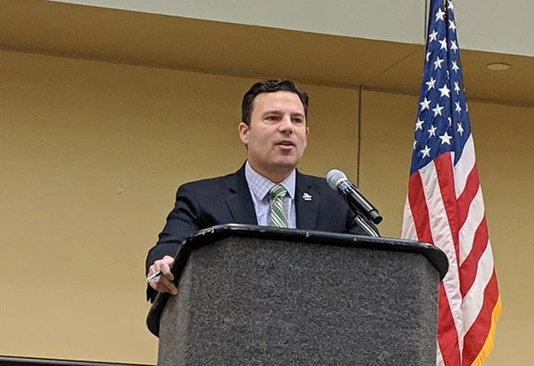 Man speaking at podium