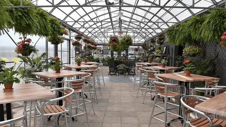 Inside of greenhouse with tables